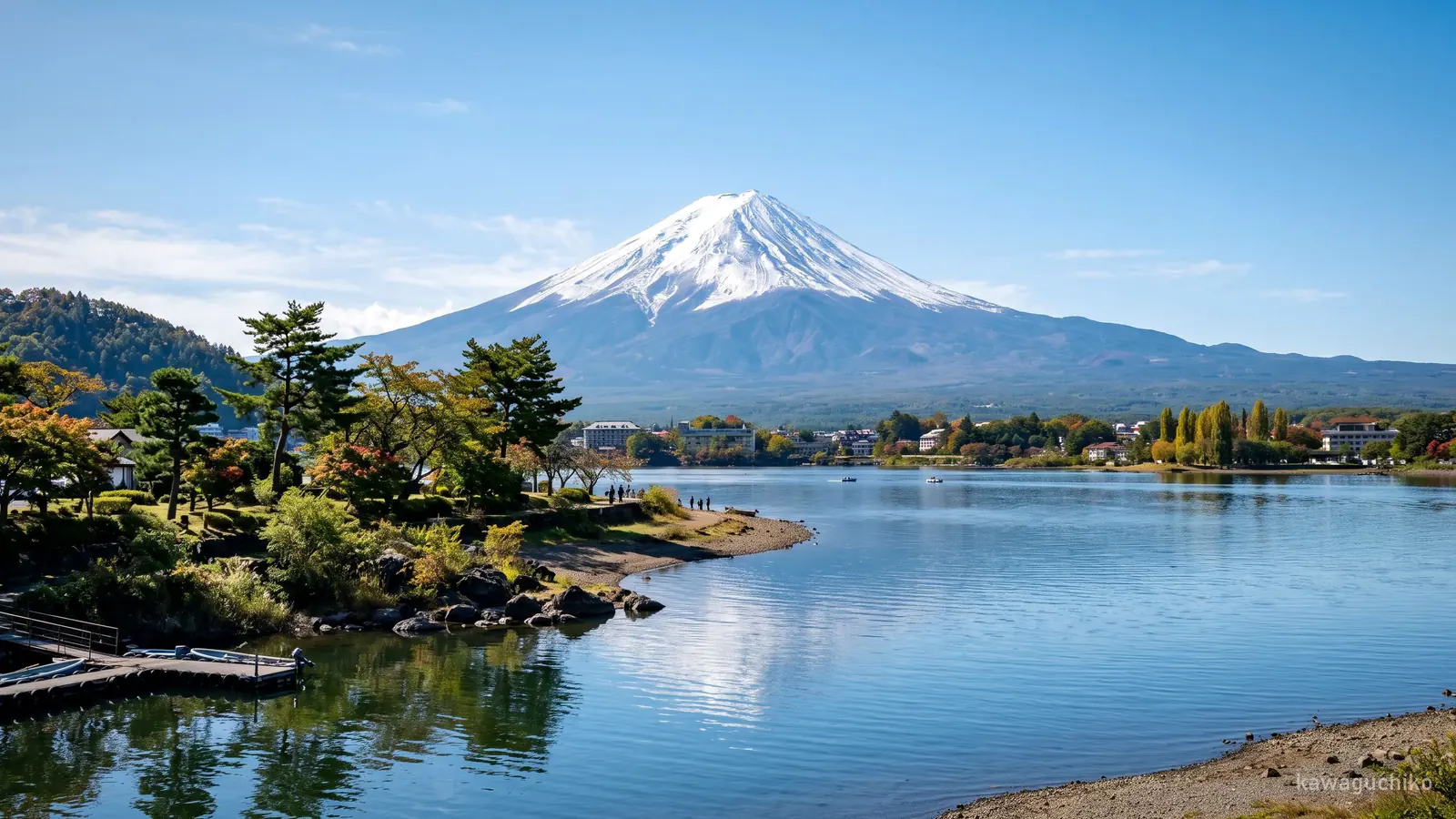 Mount Fuji reflected in the still water of Lake Kawaguchi at Oishi Park