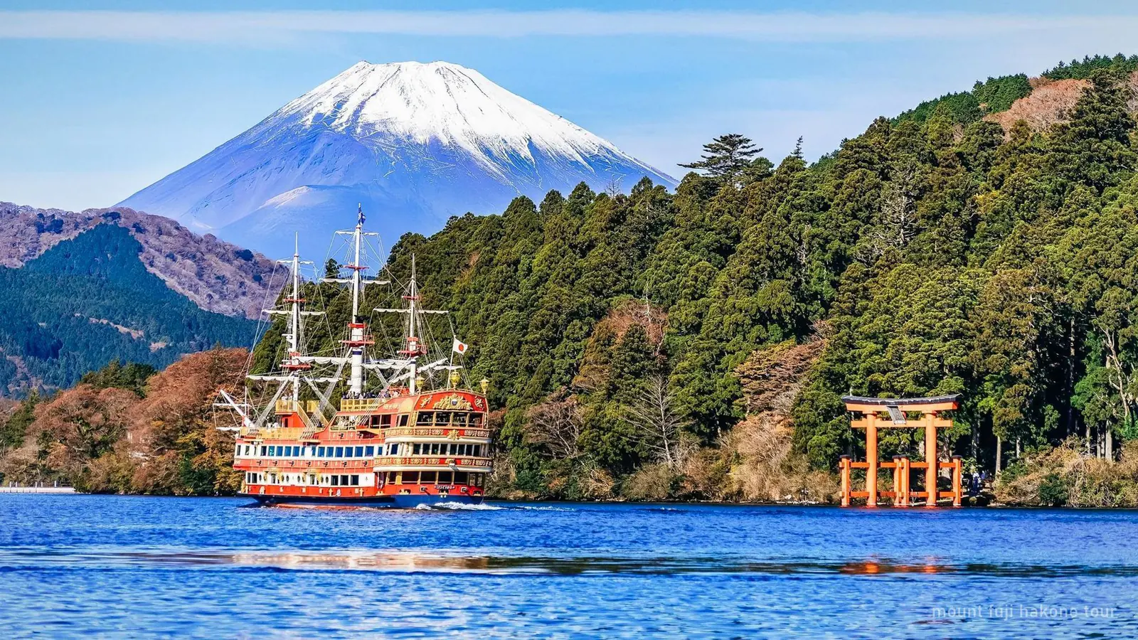 Hakone Ropeway cable car crossing the Owakudani volcanic valley with Mount Fuji visible in the distance